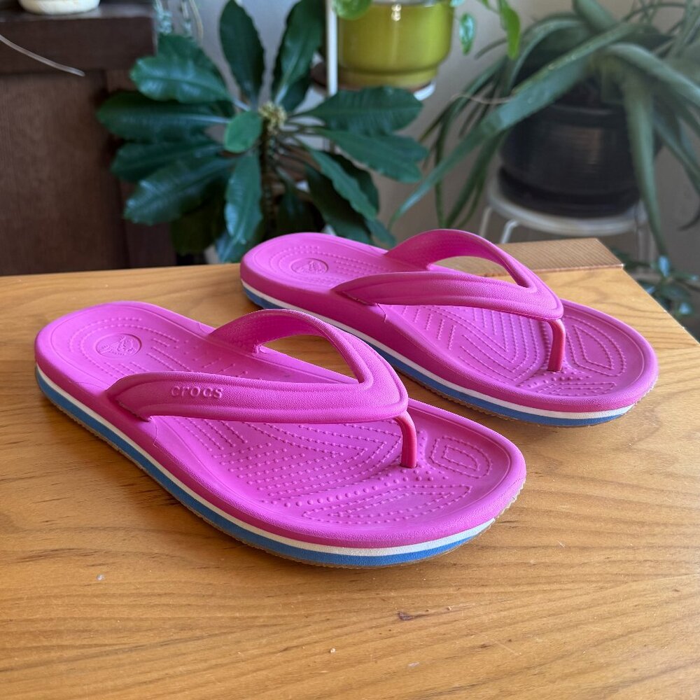 Crocs hot pink fliup flops.  Size womens 8